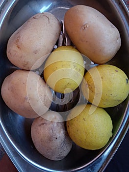 Lemon and potato  on Steele tray. photo