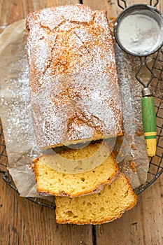 Lemon pound cake sliced with icing sugar