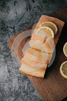 Lemon pound cake with slices of lemon sugar icing.