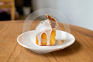Lemon pound cake on white plate