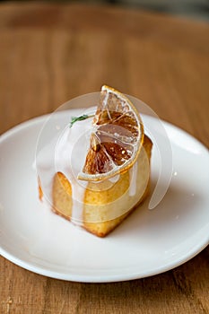 Lemon pound cake on white plate