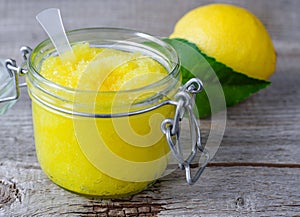 Lemon scrub with sugar, honey and olive oil photo