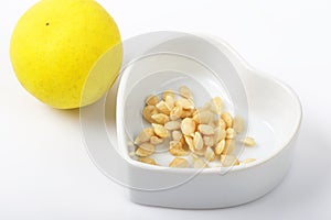 Lemon seeds are medicinal herbs on white.