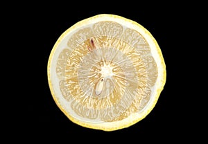 lemon slice, isolated on a black background.