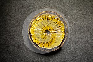 lemon slice isolated on gray background. sauteed lemon to decorate the dish