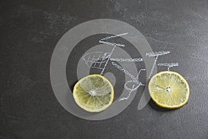 Lemon slice shape wheel of bicycle paint by chalk on black table