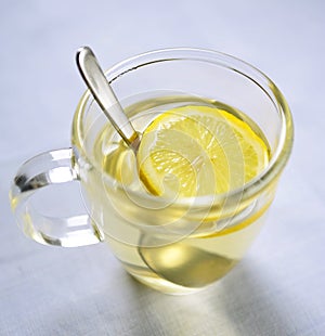 Lemon Slice & Spoon in Glass Mug of Hot Water