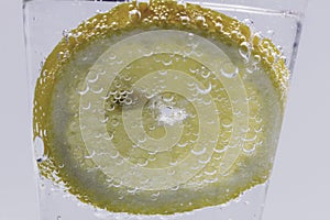 Lemon Slice In Water With Bubbles