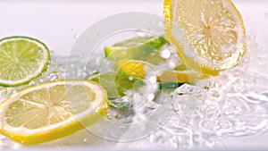 Lemon slices falling into water