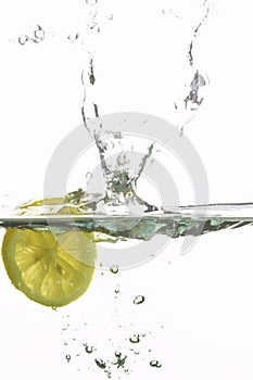 Lemon splashing water