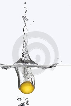 Lemon splashing in water