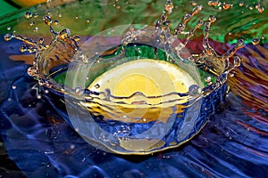 Lemon splashing in water