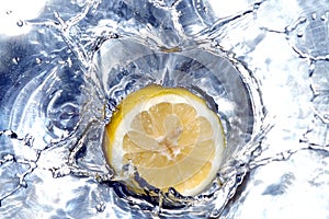 Lemon splashing water