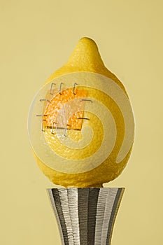 Lemon with sutures food manipulation concept