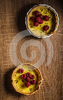 Lemon tart with rosemary and berries