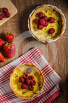 Lemon tart with rosemary and berries