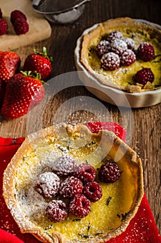 Lemon tart with rosemary and berries