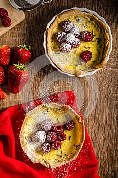 Lemon tart with rosemary and berries