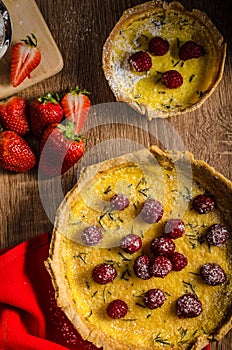 Lemon tart with rosemary and berries