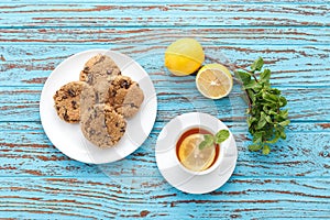 Lemon tea mint fresh drink raisin cookies summer refreshment still life