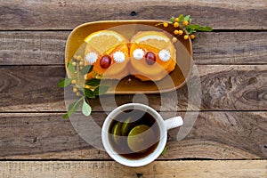 Lemon tea with orange cake dessert snack arrangement flat lay style