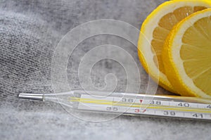 Lemon and thermometer, close up