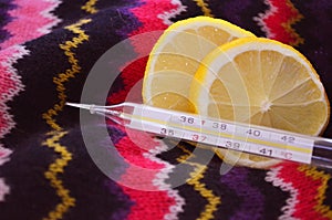 Lemon and thermometer, close up