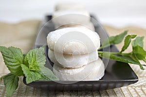 Lemon and Vanilla Shortbread Cookies Plated On Black Ceramic and