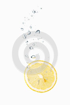 Lemon in water with air bubbles