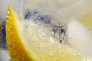 Lemon Wedge in Glass Mineral Water with Ice