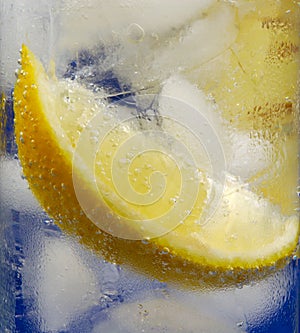 Lemon Wedge in Glass Mineral Water with Ice