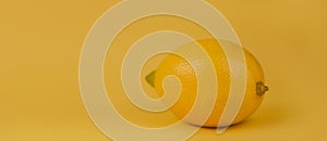 Lemon on a yellow background. Yellow lemon close-up platon on a yellow background photo