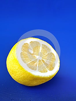 Lemon yellow bluebackground fruit citrus raw