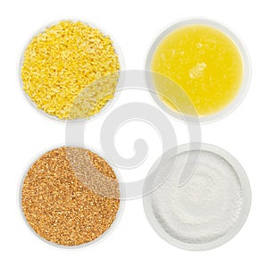 Lemon zest, fresh juice and crystalline citric acid in white glass bowls