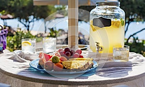 Lemonade and fruit on the beach