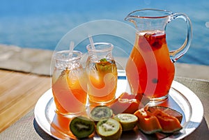 Lemonade and fruit on the beach