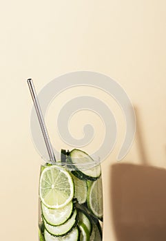 Lemonade glass with cucumber and lime. Summer cocktail. Close-up