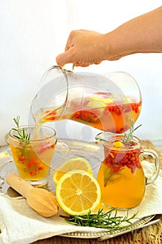 Lemonade with goji berries and rosemary