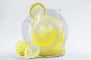 Lemonade or ice tea lemon in a white light background