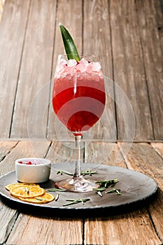 Lemonade or juice. Alcohol drink or cocktail. Images for bar or restaurant menu. Red drink with ice lemon and berries