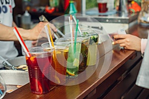 Lemonade in plastic cups in fast food cafe