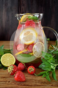 Lemonade with strawberry, lemon, mint, lime and ice cubes