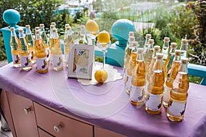 Lemonade table decorated with lemons and photo frame