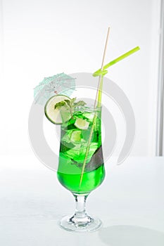 Lemonade tarhun or estragon with ice and lime on white background