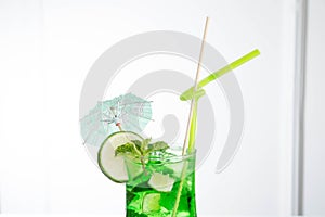 Lemonade tarhun or estragon with ice and lime on white background