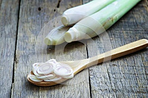 Lemongrass slice in wooden spoon on wooden table