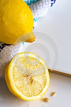 Lemons and cloth on white board background with copy space