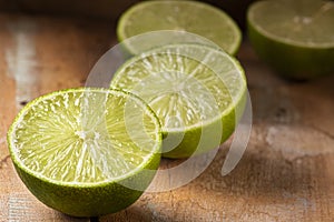 Lemons cut in half. Wood background photo