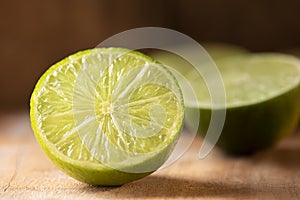 Lemons cut in half. Wood background photo