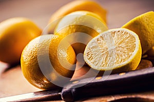 Lemons cut into the old kitchen board with mint leaves